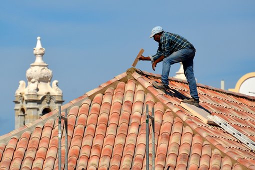 Man fixing roof